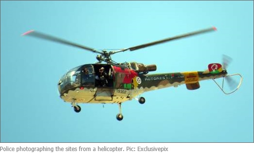 Police photographing the sites from a helicopter. Pic: Exclusivepix